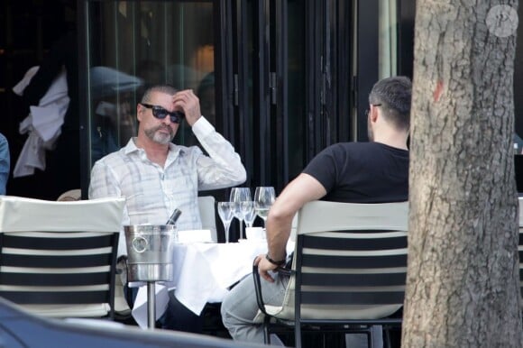 George Michael et son petit ami Fadi Fawaz le 23 mars 2012 à Paris