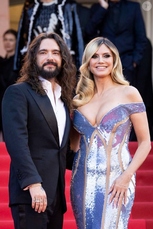 Il s'agit d'Heidi Klum et Tom Kaulitz

Heidi Klum et son mari Tom Kaulitz - Montée des marches du film « Mission Impossible : The Final Reckoning » lors du 78ème Festival International du Film de Cannes, au Palais des Festivals à Cannes. Le 14 mai 2025
© Jacovides-Moreau / Bestimage