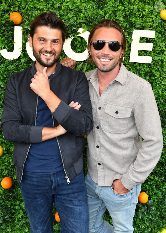 Christophe Beaugrand et son mari Ghislain Gerin - Soirée d’anniversaire des 5 ans de la marque Joone, sur la péniche La Barge à Issy-les-Moulineaux. Paris, le 30 juin 2022
© Veeren / Bestimage