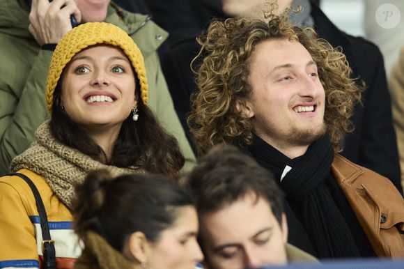 Jenaye Noah et son frère Joalukas Noah - Célébrités dans les tribunes lors du match de Ligue 1 McDonald's opposant le Paris Saint-Germain (PSG) à l'Olympique de Marseille (OM) - (3-1) au Parc des Princes à Paris le 16 mars 2025. © Cyril Moreau/Bestimage