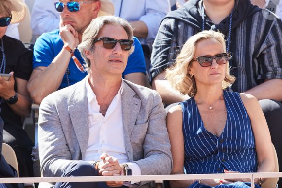 Laurent Solly (président de Facebook France) et sa femme Caroline Roux - Célébrités dans les tribunes des Internationaux de France de tennis de Roland Garros 2024 à Paris le 7 juin 2024.  © Jacovides-Moreau/Bestimage