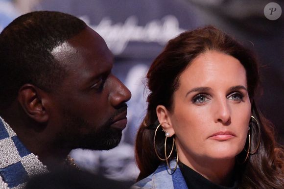 Omar Sy, et Helene Sy, sa femme, au premier rang lors du défilé Louis Vuitton Menswear Fall/Winter 2024-2025 dans le cadre de la semaine de la mode à Paris le 16 janvier 2024 à Paris, France. Photo de Jana Call me J/ABACAPRESS.COM