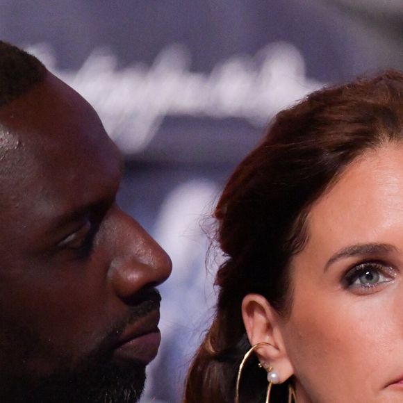 Omar Sy, et Helene Sy, sa femme, au premier rang lors du défilé Louis Vuitton Menswear Fall/Winter 2024-2025 dans le cadre de la semaine de la mode à Paris le 16 janvier 2024 à Paris, France. Photo de Jana Call me J/ABACAPRESS.COM