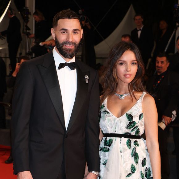 Si cette année, la jolie brune de 32 ans en a profité pour officialiser son couple avec le footballeur Karim Benzema, elle est aussi présente pour le film "Les aigles de la République", de Tarik Saleh

Karim Benzema et sa compagne Lyna Khoudri lors de la montée des marches du film « 13 jours 13 nuits » lors du 78ème Festival International du Film de Cannes. Le 23 mai 2025 
© Jacovides-Moreau / Bestimage