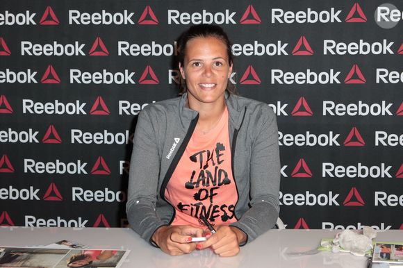 L'ambassadrice de l'équipe Reebok, Laure Manaudou, assiste à une séance de dédicaces pour le lancement de la campagne " Live with Fire " qui s'est tenue au magasin Intersport Rivoli à Paris, France, le 23 avril 2014. Photo par Audrey Poree/ABACAPRESS.COM