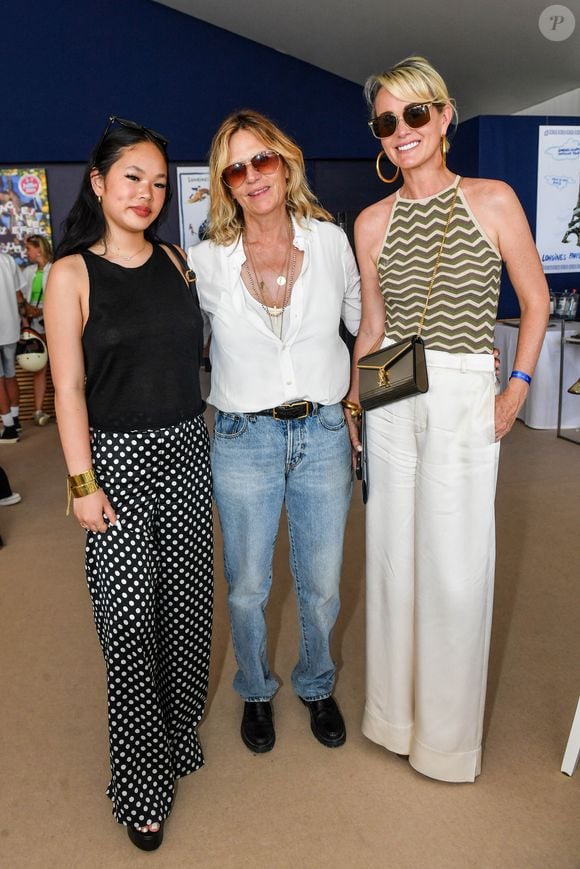 Exclusif -  Laeticia Hallyday avec sa fille Joy et Virginie Coupérie-Eiffel dans l'Espace VIP lors de la 9ème édition du "Longines Paris Eiffel Jumping" au Champ de Mars à Paris, France, le 25 juin 2023. © Perusseau-Veeren/Bestimage