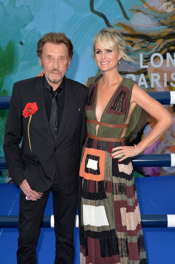 Exclusif - Johnny Hallyday et sa femme Laeticia Hallyday - Soirée au profit de l'Association "La Bonne étoile" de Laeticia Hallyday lors du 3ème Longines Paris Eiffel Jumping à la plaine de Jeux de Bagatelle à Paris le 1er juillet 2016 dans le Pavillon Eiffel du Longines Paris Eiffel Jumping décoré par Luxury Living. © Olivier Borde / Veeren / Bestimage