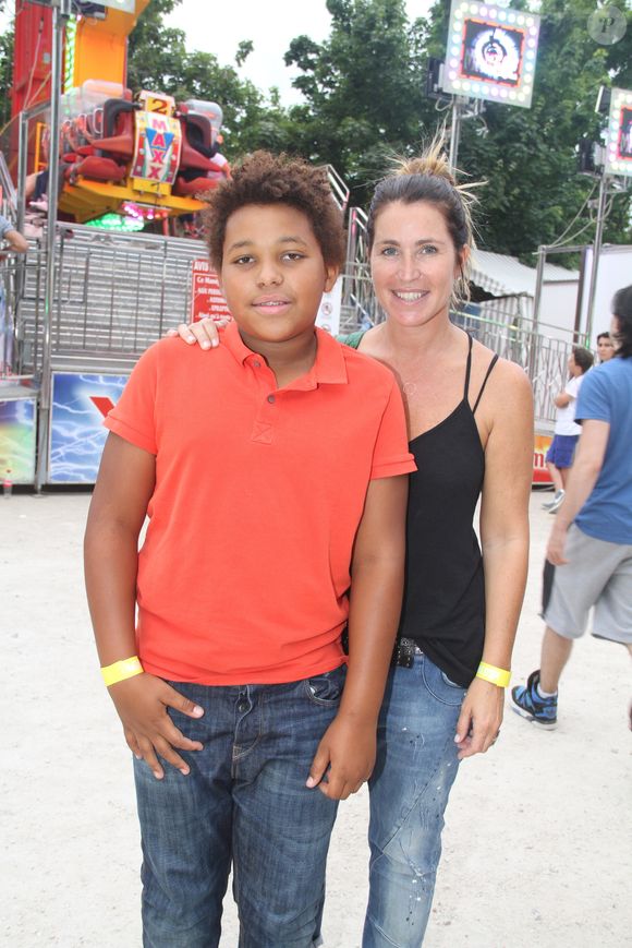 Sandrine Diouf et son fils Isaac - Inauguration de la Fête des Tuileries à Paris le 26 juin 2015.
BALDINI / BESTIMAGE