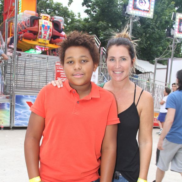 Sandrine Diouf et son fils Isaac - Inauguration de la Fête des Tuileries à Paris le 26 juin 2015.
BALDINI / BESTIMAGE