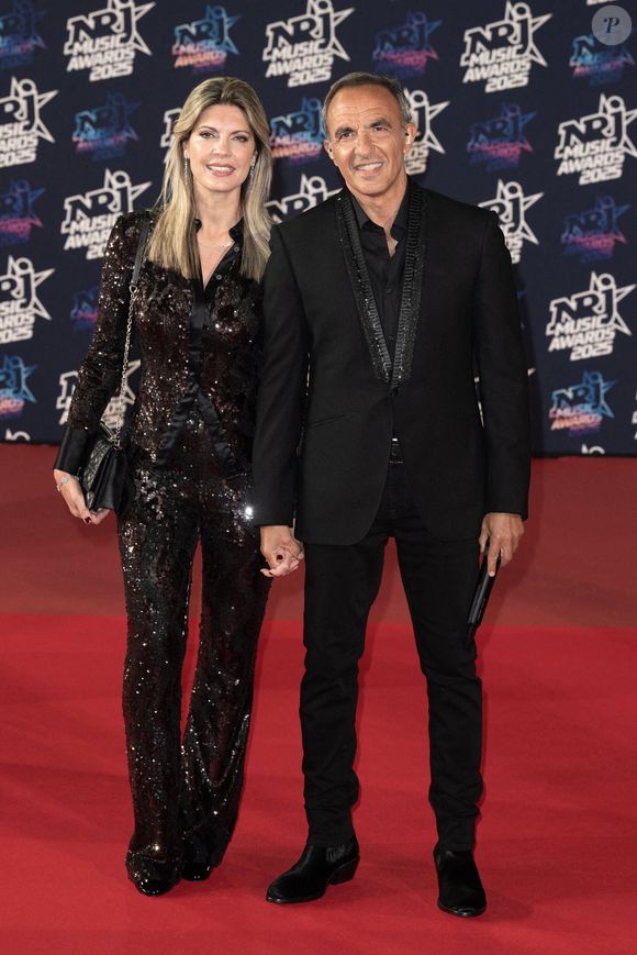 Nikos Aliagas et sa femme Tina Grigoriou assistent à la 27ème édition des NRJ Music Awards le 31 octobre 2025 à Cannes, France. Photo by David NIVIERE/ABACAPRESS.COM