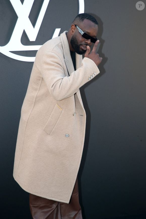 Le frère de Dadju est sur tous les fronts puisqu'il s'est récemment lancé en tant que promoteur dans un grand projet immobilier de luxe. 

Gims - Célébrités au Défilé Louis Vuitton, Collection Prêt-à-porter Printemps / Eté 2025 dans le cadre de la Fashion Week de Paris, France, le 1er Octobre 2024. 

© Bertrand Rindoff / Bestimage