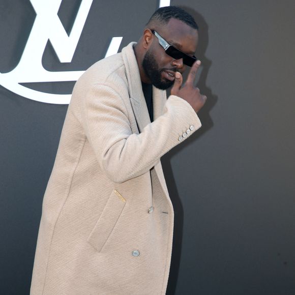 Le frère de Dadju est sur tous les fronts puisqu'il s'est récemment lancé en tant que promoteur dans un grand projet immobilier de luxe. 

Gims - Célébrités au Défilé Louis Vuitton, Collection Prêt-à-porter Printemps / Eté 2025 dans le cadre de la Fashion Week de Paris, France, le 1er Octobre 2024. 

© Bertrand Rindoff / Bestimage