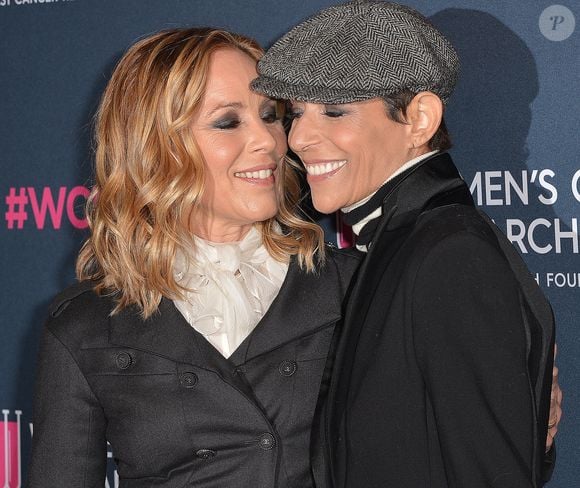 Maria Bello et sa fiancée Dominique Crenn au photocall de la soirée "Women's Cancer Research Fund" à Los Angeles, le 27 février 2020.