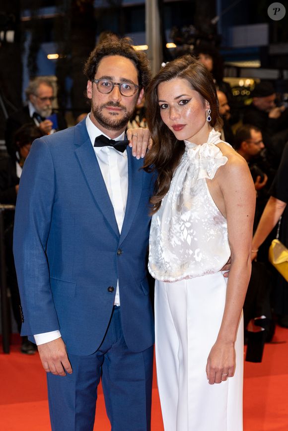 Thomas Hollande, sa femme Emilie Broussouloux - Montée des marches du film "R.M.N." lors du 75ème Festival International du Film de Cannes, le 21 mai 2022.
© Cyril Moreau / Bestimage