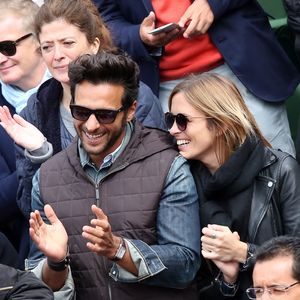 Maxim Nucci (Yodelice) et sa compagne Isabelle Ithurburu dans les tribunes des Internationaux de France de tennis de Roland Garros à Paris. Le 24 mai 2016
© Dominique Jacovides / Bestimage