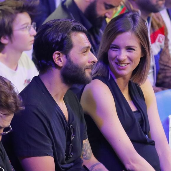 Maxim Nucci (Yodelice)  et sa compagne enceinte Isabelle Ithurburu - Maxim Nucci (Yodelice)  et sa compagne enceinte Isabelle Ithurburu assistent au match de boxe de Tony Yoka au palais des sports de Paris, le 23 juin 2018 © Veeren-CVS/Bestimage