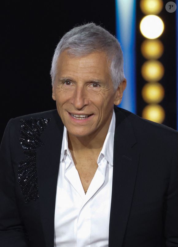 Et de compléter : On a aussi veillé à répartir plus clairement les rôles à l'animation, ce qui s'est ressenti dès la deuxième soirée". Quant à une possible saison 2 ? La star du PAF En rêve : "Mais la décision ne dépend pas de moi".

Nagui - Les célébrités se mobilisent pour la 38ème édition du Téléthon dans les studios de France 2 à Paris © Coadic Guirec / Bestimage