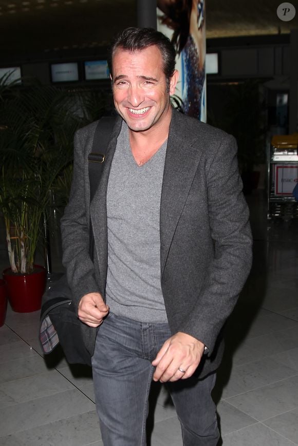 Jean Dujardin à l'aéroport de Roissy en 2012.