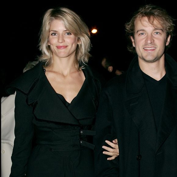 Alice Taglioni et son ex-compagnon Jocelyn Quivrin au défilé de mode "Dior" collection prêt à porter printemps-été 2006 au Grand Palais à Paris. AGENCE / BESTIMAGE