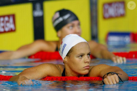 L'Américaine Natalie Coughlin remporte la médaille d'or et la Française Laure Manaudou la médaille d'argent au 100 mètres dos féminin lors des 12èmes Championnats du Monde FINA, à la Rod Laver Arena, à Melbourne, Australie, le 27 mars 2007. Photo by Nicolas Gouhier/Cameleon/ABACAPRESS.COM