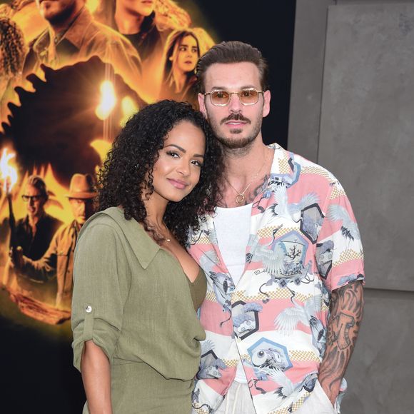 La musique occupe une place centrale dans la vie familiale, permettant à M. Pokora de partager des activités et d’éveiller ses enfants artistiquement.

Christina Milian et son mari M Pokora (Matt Pokora) à la première du film "Jurassic World Dominion" à Los Angeles, le 6 juin 2022. Broadimage / Bestimage