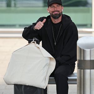Manchester, UNITED KINGDOM French footballer Olivier Giroud seen waiting for transport after he arrives at Manchester Airport for World Cup commentary duties for the BBC Pictured: Olivier Giroud