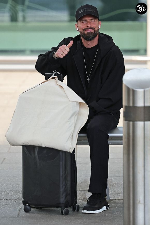 Manchester, UNITED KINGDOM  French footballer Olivier Giroud seen waiting for transport after he arrives at Manchester Airport for World Cup commentary duties for the BBC    Pictured: Olivier Giroud