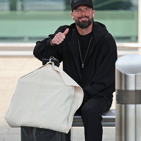 Manchester, UNITED KINGDOM  French footballer Olivier Giroud seen waiting for transport after he arrives at Manchester Airport for World Cup commentary duties for the BBC    Pictured: Olivier Giroud