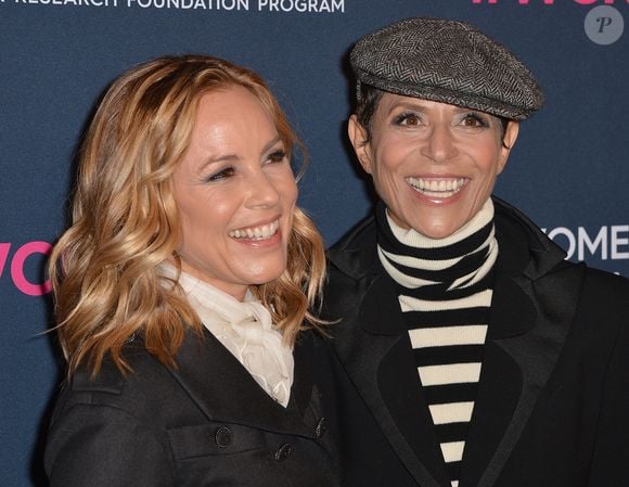 Maria Bello et sa fiancée Dominique Crenn au photocall de la soirée "Women's Cancer Research Fund" à Los Angeles, le 27 février 2020.