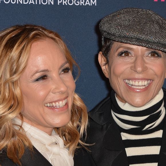 Maria Bello et sa fiancée Dominique Crenn au photocall de la soirée "Women's Cancer Research Fund" à Los Angeles, le 27 février 2020.