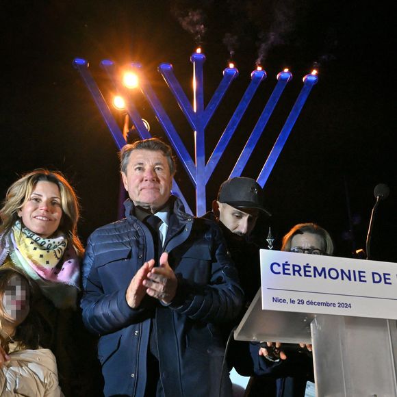 Exclusif - Christian Estrosi, le maire de Nice, sa femme Laura Tenoudji Estrosi et leur fille Bianca ont participé à l'allumage de la 5eme bougie de la fête juive de Hanoucca (noël juif) à Nice, au jardin d'Arménie, près de la Promenade des Anglais, le 29 décembre 2024.  © Bruno Bebert/Bestimage