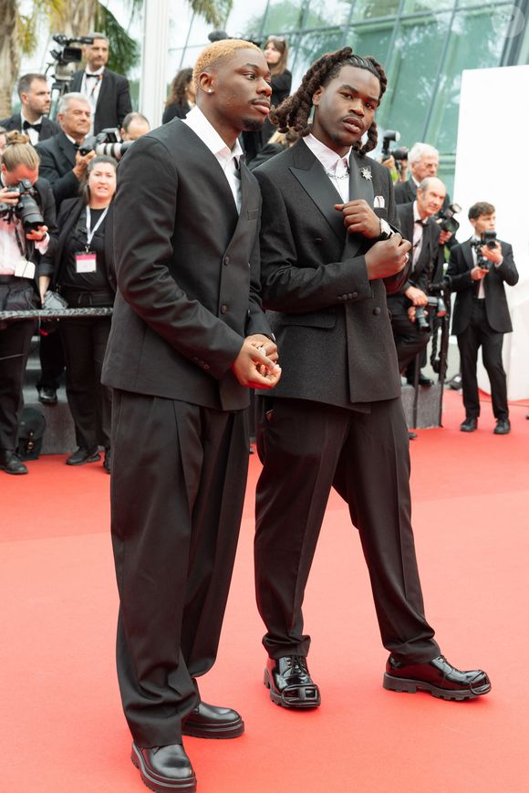 Tiakola (Bijoux Messika), Genezio (Bijoux Messika) - Montée des marches du film « Highest 2 Lowest  » lors du 78ème Festival International du Film de Cannes, au Palais des Festivals à Cannes. Le 19 mai 2025
© Olivier Borde/ Bestimage