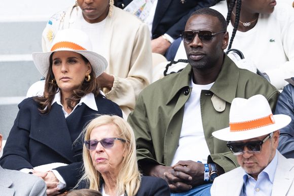Omar Sy et sa femme Hélène en tribunes lors des Internationaux de France de Tennis de Roland Garros 2025, à Paris, France, le 7 juin 2025. © Cyril Moreau/Bestimage
