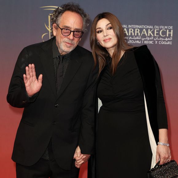 elle dit toujours croire en l'amour, même si cela peut paraître un peu fou.

Tim Burton et Monica Bellucci au photocall de la cérémonie d'ouverture et à la projection du film "L'Ordre" lors du 21ème Festival international du film de Marrakech, le 29 novembre 2024j à Marrakech, Maroc. © Dominique Jacovides/Bestimage