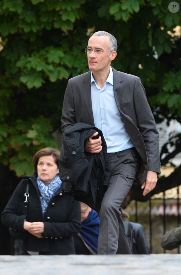 Gilles Bouleau aux obseques de Benoit Duquesne a l'eglise Jeanne D'Arc de Versailles, France, le 10 juillet 2014. Photo ABACAPRESS.COM