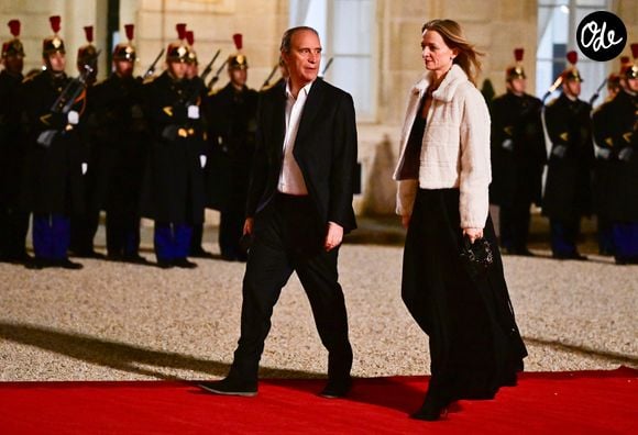 Xavier Niel et sa compagne Delphine Arnault au dîner d’état donné en l’honneur du président de l’Ouzbékistan au palais présidentiel de l’Elysée, à Paris, France, le 12 mars 2025. © Christian Liewig/Bestimage