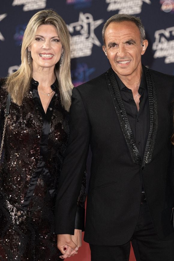 Nikos Aliagas et sa femme Tina Grigoriou assistent à la 27ème édition des NRJ Music Awards le 31 octobre 2025 à Cannes, France. Photo par David NIVIERE/ABACAPRESS.COM