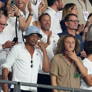 Yannick Noah et son fils Joalukas - People dans les tribunes lord du match d'ouverture de la Coupe du Monde de Rugby France 2023 avant le match de la Poule A entre la France et la Nouvelle-Zélande au Stade de France à Saint-Denis le 8 septembre 2023.  © Dominique Jacovides/Bestimage