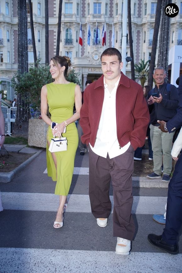 Exclusif - Iris Mittenaere (Miss France 2016 - Miss univers 2017) et son compagnon Antoine Dupont arrivent à la soirée "Kilian Paris" sur la plage du Carlton Beach Club lors du 79ème Festival International du Film de Cannes, le 19 mai 2026.