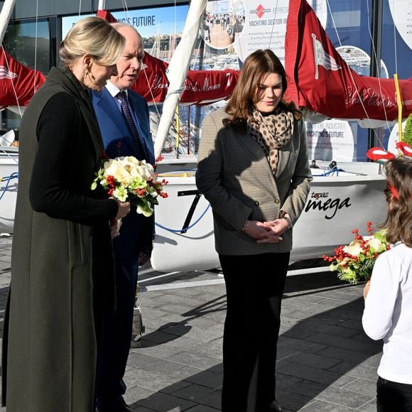 Le prince Albert II de Monaco, sa femme la princesse Charlene et Camille Gottlieb ont remis les traditionnels colis de Noël aux aînés monégasques dans la meeting room du Yacht Club de Monaco dans le cadre de festivités de fin d'année de la Principauté de Monaco, le 12 décembre 2024. © Bruno Bebert/Pool Monaco/Bestimage