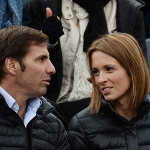 Isabelle Ithurburu et Gonzalo Quesada regardent un match lors du deuxième tour des Internationaux de France de tennis à Roland Garros à Paris, France, le 28 mai 2014. Photo Laurent Zabulon/Abaca