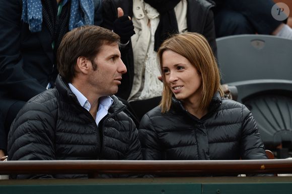 Isabelle Ithurburu et Gonzalo Quesada regardent un match lors du deuxième tour des Internationaux de France de tennis à Roland Garros à Paris, France, le 28 mai 2014. Photo Laurent Zabulon/Abaca