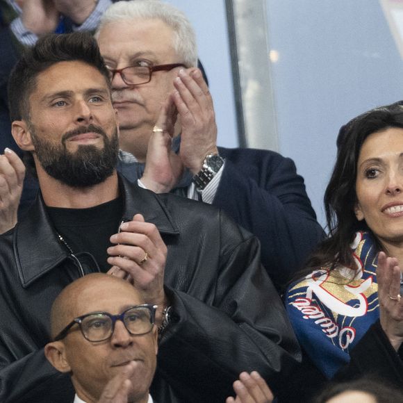 Olivier Giroud et sa femme Jennifer Giroud, Philippe Diallo - Célébrités dans les tribunes du quart de finale de la Ligue des Nations de l'UEFA 2025 "France - Croatie (2-0 / tab 5-4)" au Stade de France à Saint-Denis le 23 mars 2025. © Cyril Moreau/Bestimage