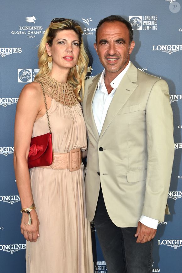 Exclusif - Nikos Aliagas et sa compagne Tina Grigoriou - Photocall du Longines Paris Eiffel Jumping au Champ de Mars à Paris le 7 juillet 2018. ©Veeren-Perusseau/Bestimage