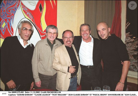 Son ami Claude Lelouch avait filmé ses mots sur le cancer depuis son lit d'hôpital

Exclusif : Gérard Darmon, Claude Lelouch, Ticky Holgado, Jean-Claude Darmon  et Pascal Obispo à l'Etoile à Paris en 2002 ©Rachid Bellak