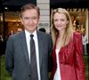 Le père de cinq enfants – issus de deux mariages, Delphine, Antoine, Alexandre, Frédéric et Jean – a ainsi livré sa règle des 20-80, clé de la réussite.
Bernard Arnault et sa fille Delphine Arnault, dans la boutique Kenzo à Paris
