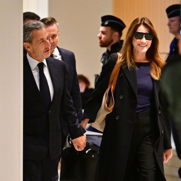 Une annonce particulièrement attendue... 

Nicolas Sarkozy et sa femme Carla Bruni au Tribunal judiciaire (Batignolles, 32ème chambre correctionnelle) pour l'annonce de la décision dans le cadre du procès Lybien.  © Christian Liewig / Bestimage