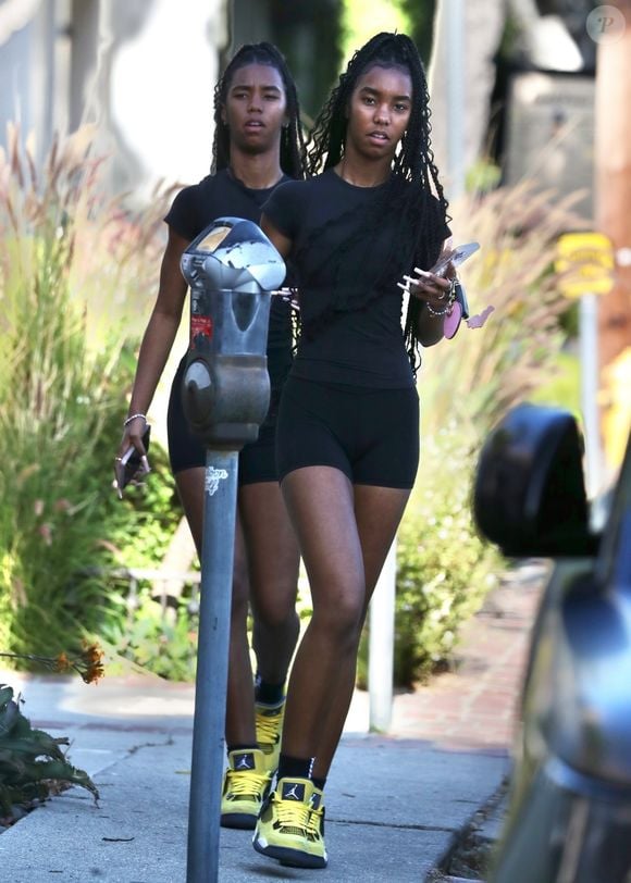 Los Angeles, CA  - EXCLUSIVE  - D'Lila Star and Jessie James Combs, the twin daughters of P Diddy, were seen in LA at SEV Laser hair removal, rocking matching all-black outfits and yellow retro Jordan sneakers for a stylish and coordinated look.



Pictured: D'Lila Star, Jessie James Combs