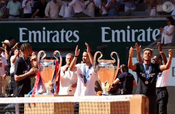 Bradley Barcola, Warren Zaïre-Emery, Désiré Doué et Ousmane Dembélé - Le Paris Saint-Germain (PSG) présente ses trophées de Ligue des champions aux Internationaux de de Tennis de Roland Garros 2026, à Paris, France, le 1er juin 2026. © Jacovides-Moreau/Bestimage