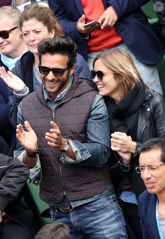 Maxim Nucci (Yodelice) et sa compagne Isabelle Ithurburu dans les tribunes des Internationaux de France de tennis de Roland Garros à Paris. Le 24 mai 2016 
© Dominique Jacovides / Bestimage
